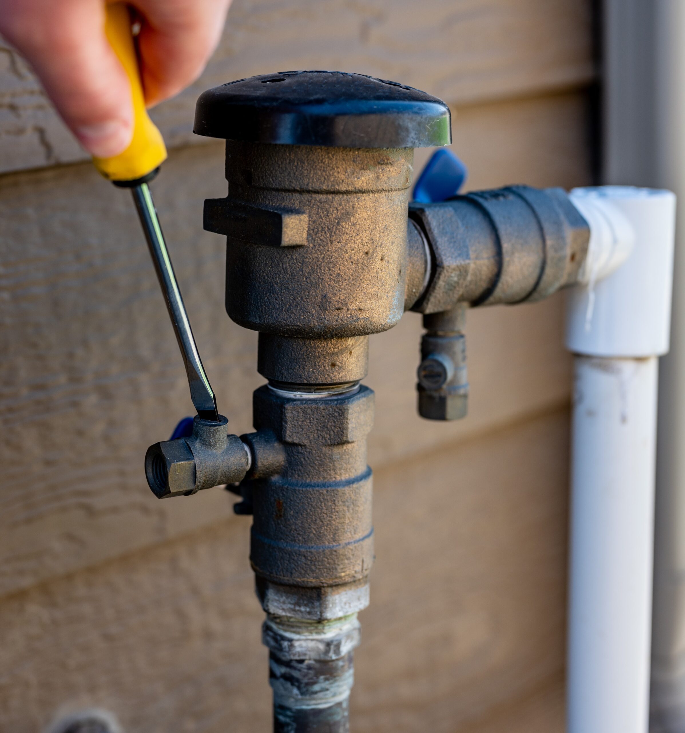 Damaged irrigation backflow preventer needing repair